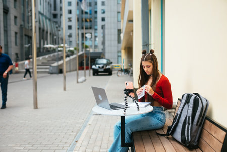 Freelance woman in a summer cafe preparing to work.の写真素材