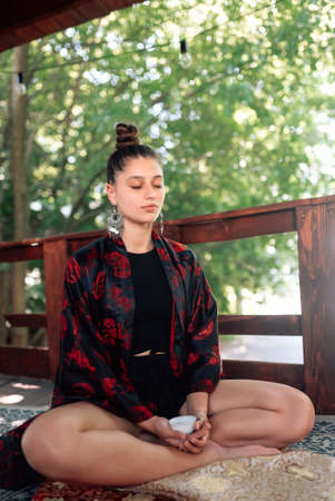 Tea ceremony is performed by tea master in kimonoの写真素材