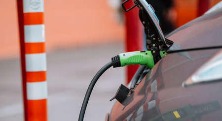 Power supply connect to electric vehicle for charge to the battery.の写真素材