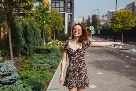 Young pretty trendy girl posing at the city in Europeの写真素材