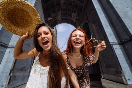 Sexy carefree women posing on street background.の写真素材