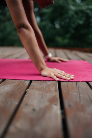 A young woman in doing yoga in the yardの写真素材