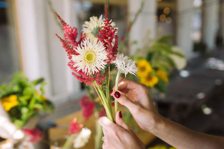 Florist woman makes a bouquet of fresh wildflowersの写真素材