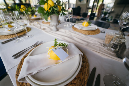 Festive table at the wedding party decorated with lemon arrangementsの写真素材