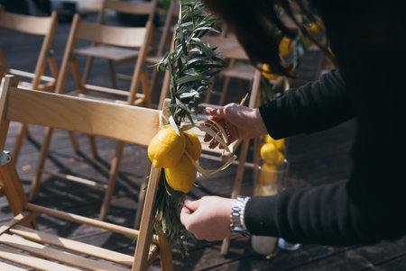 The girl decorates a chair. Decoration details.の写真素材