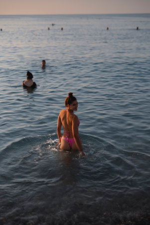 Experience Serene Beach Moments as the Golden Sun Sets, Embracing Pure Tranquilityの写真素材