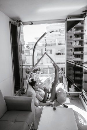 Enjoying Relaxation in a Contemporary Modern Space Embracing a Day in the Warm Sunlightの写真素材