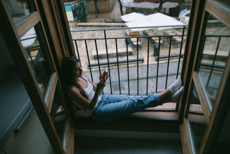 Indulging in Casual Relaxation within a Beautifully Designed, Modern Window Nook Spaceの写真素材