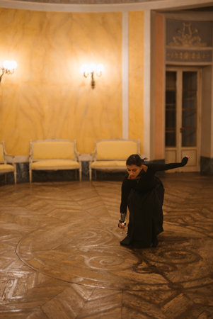 Engaging in a contemplative dance performance within a historically rich interior setting