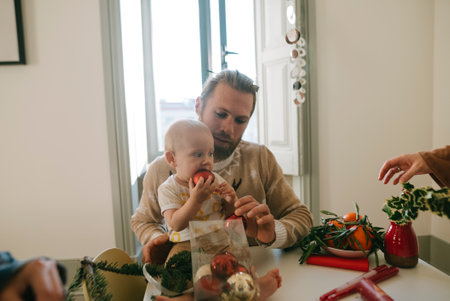 A Father and Child Engaged in Crafting Activities Together in a Cozy Atmosphere Full of Warmthの写真素材