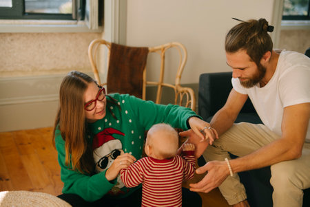 Enjoying a heartwarming family bonding moment with the adorable baby in a cozy indoor setting
