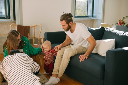 Cherishing Family Bonding Moments with the Baby in the Comfort of Our Home Environmentの写真素材