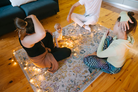 Join us for a charming Group Meditation with Fairy Lights, a Doll, and a cozy Rugの写真素材