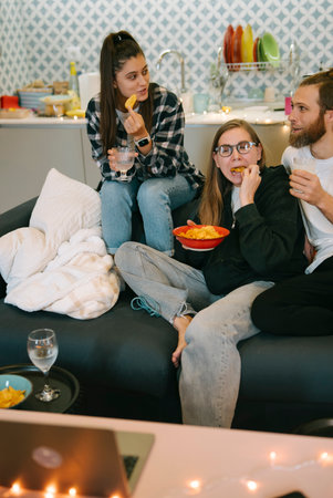 Enjoy a relaxed evening with friends, good snacks, drinks, and engaging conversationの写真素材