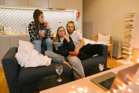 Enjoy a cozy movie night experience with friends at the comfort of your own home environmentの写真素材