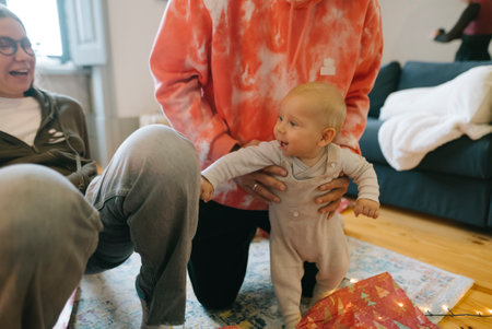 A Joyful Family Moment Featuring a Cute Baby During a Special Celebration Together with Loved Onesの写真素材