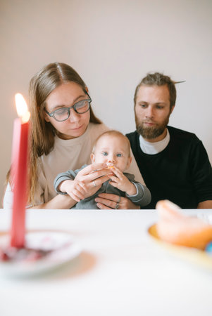 Family Dinner with Baby Enjoying a Cozy and Intimate Moment Together as a Familyの写真素材