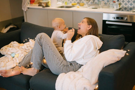 A Joyful and Heartwarming Moment Shared Between a Mother and Her Child in a Cozy Living Room Setting
