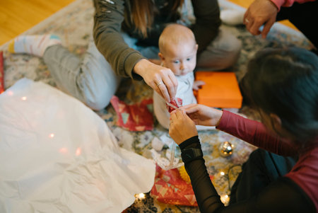 Enjoying a Family Gathering Together During the Holidays Celebrating with a Babyの写真素材