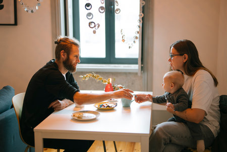 Cherishing Family Breakfast Moments Together with Our Adorable Baby and Creating Memoriesの写真素材