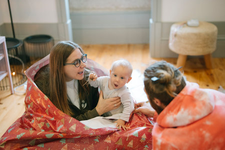 Cherishing Family Bonding Moments with Baby in a Warm and Cozy Atmosphere, Filled with Joyの写真素材