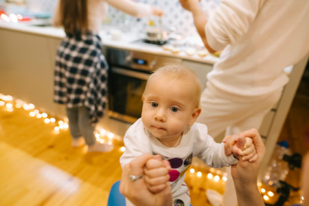 Experiencing Joyful Baby Moments Amidst Delightful Family Gatherings and Celebrationsの写真素材