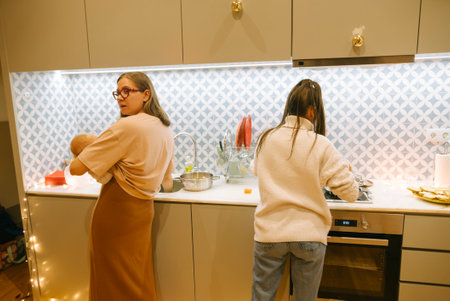 Women Enjoying Cooking Together in a Bright and Modern Kitchen Setting and Atmosphere
