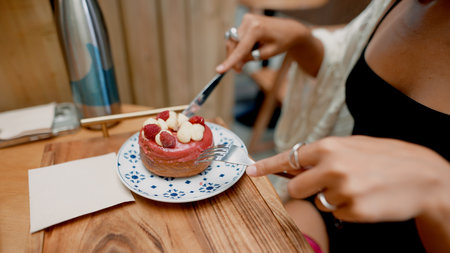 Indulge in a delicious cake while enjoying the cozy atmosphere of a charming cafe