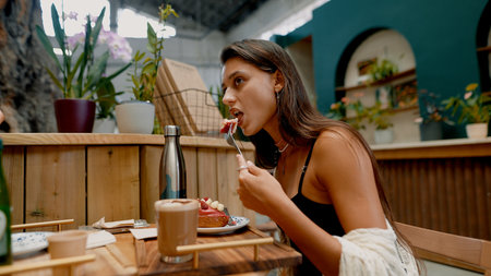 Savoring a Sweet Dessert While Soaking Up the Cozy Atmosphere of a Charming Cafe