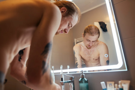 Individual engaged in energetic morning cleansing routine at sinkの写真素材