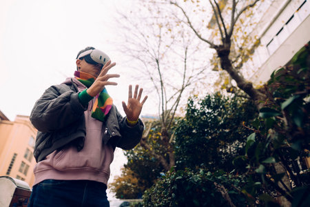 Street singer expressing emotions amid urban courtyard surroundingsの写真素材