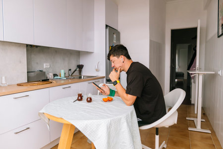 Solo individual having simple meal in contemporary interiorの写真素材
