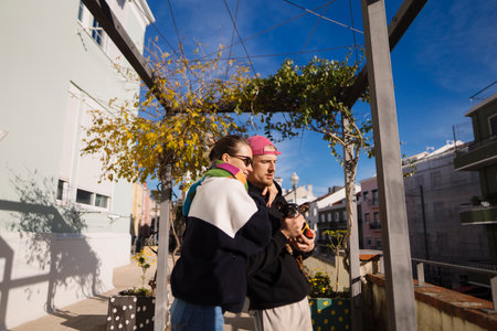 Nighttime romance as couple relaxes beneath vineenveloped structureの写真素材