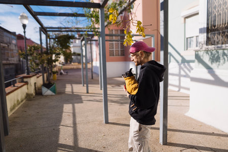 Male delivery person navigates cityscape with strategic precisionの写真素材