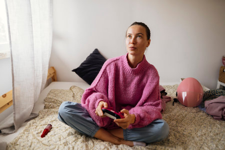 Calm woman resting in cozy bedroom
