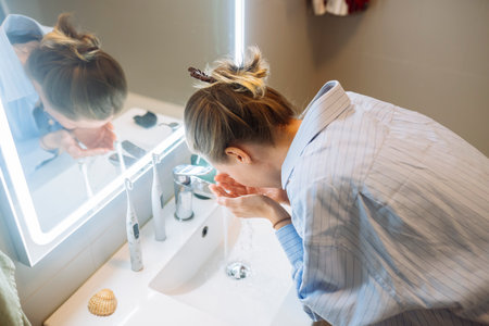 She methodically scrub her face to ensure cleanliness and freshness