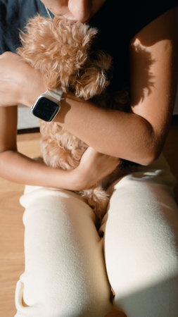 Tranquil moment where woman attentively looks after her playful puppy