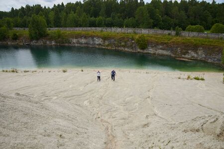 02-08-2017 Riga, Latvia. Landscape with high mountain, lake and cloudsのeditorial素材