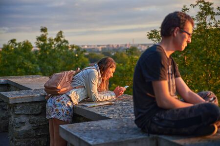 06-08-2017 Tallinn Estonia Woman sightseeing Tallinn city landmarks vacations in Estonia travel lifestyle girl tourist relaxing at viewpoint Old Town aerial view architectureのeditorial素材