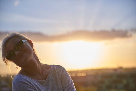 05-08-2017 Tallinn Estonia Happy Woman smiling at sunsetのeditorial素材
