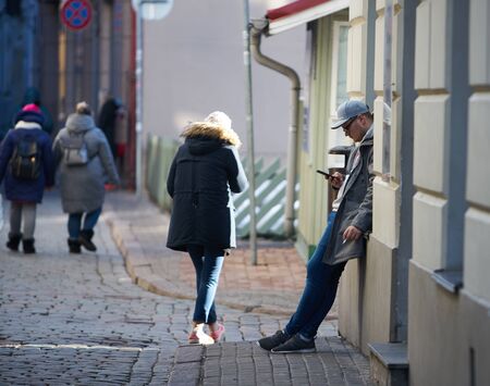 12-10-2018 RIga, Latvia Young handsome male in the city using his smartphone.のeditorial素材