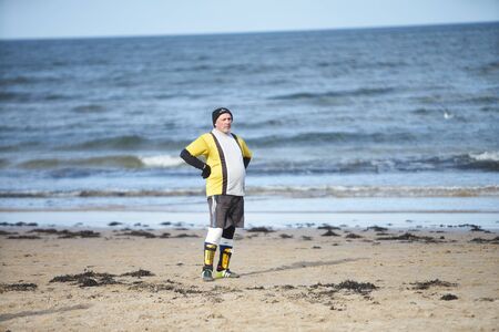 05-11-2018 Jurmala, Latvia Friends playing football at the beachのeditorial素材