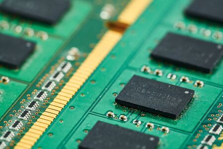 Electronic microcircuit with microchips and capacitors taken closeup