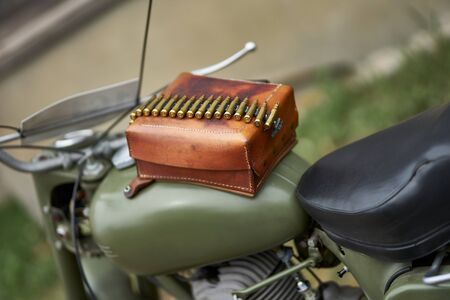 Rifle bullets at leather box