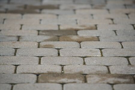 abstract background of cobble stone road making from cement blocksの写真素材