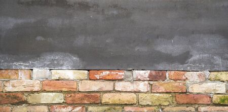 A Blank Gray Sign For Your Text On A Red Brick Wall.