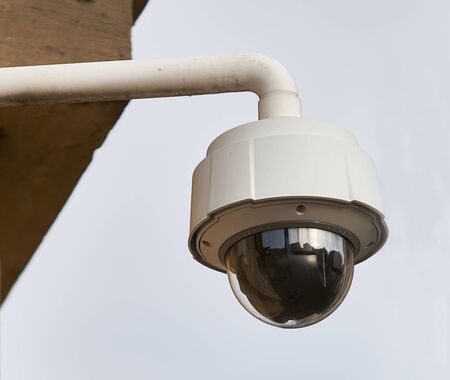 Security Camera, CCTV on location. Security camera on the wall in old city.