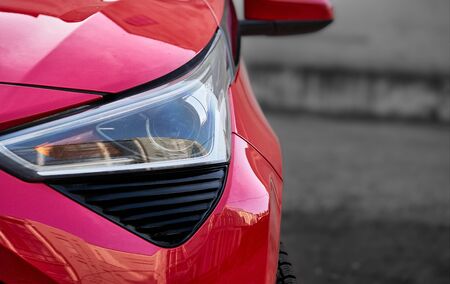 Headlights and hood of sport red car with silver starsの写真素材