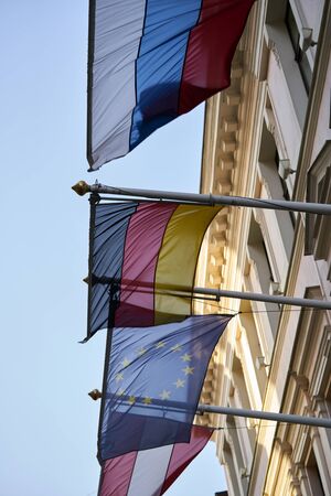 European Union flag as background.