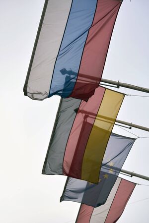European Union flag as background.